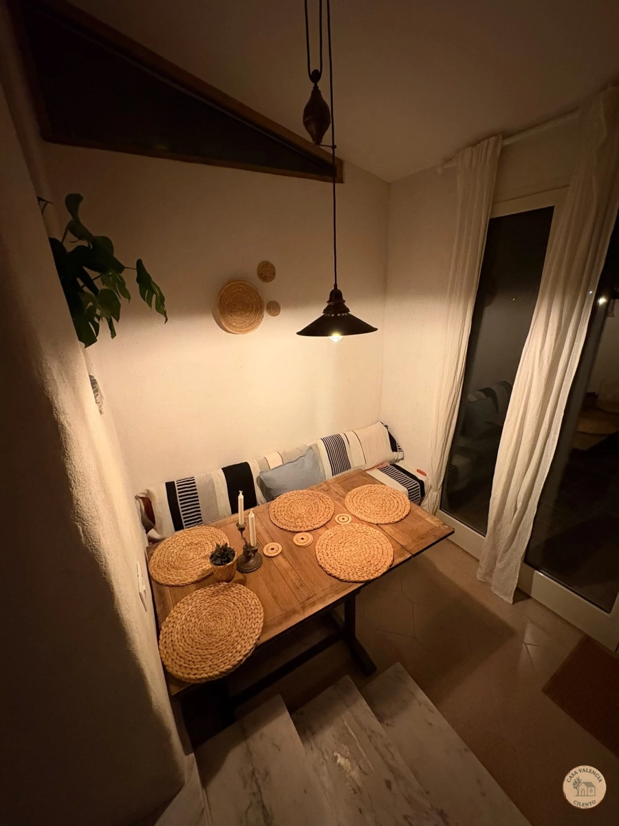 Living-dining room at dusk, Casa Valencia Cilento